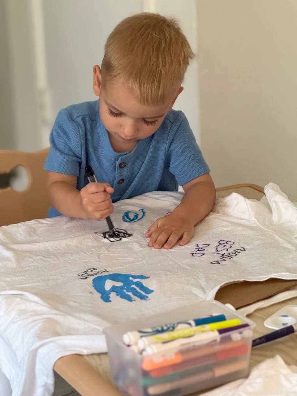 Aaron painting at the art table